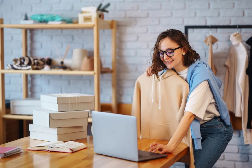 Female warehouse worker, seller, dropshipping small business owner recording new content for vlog.