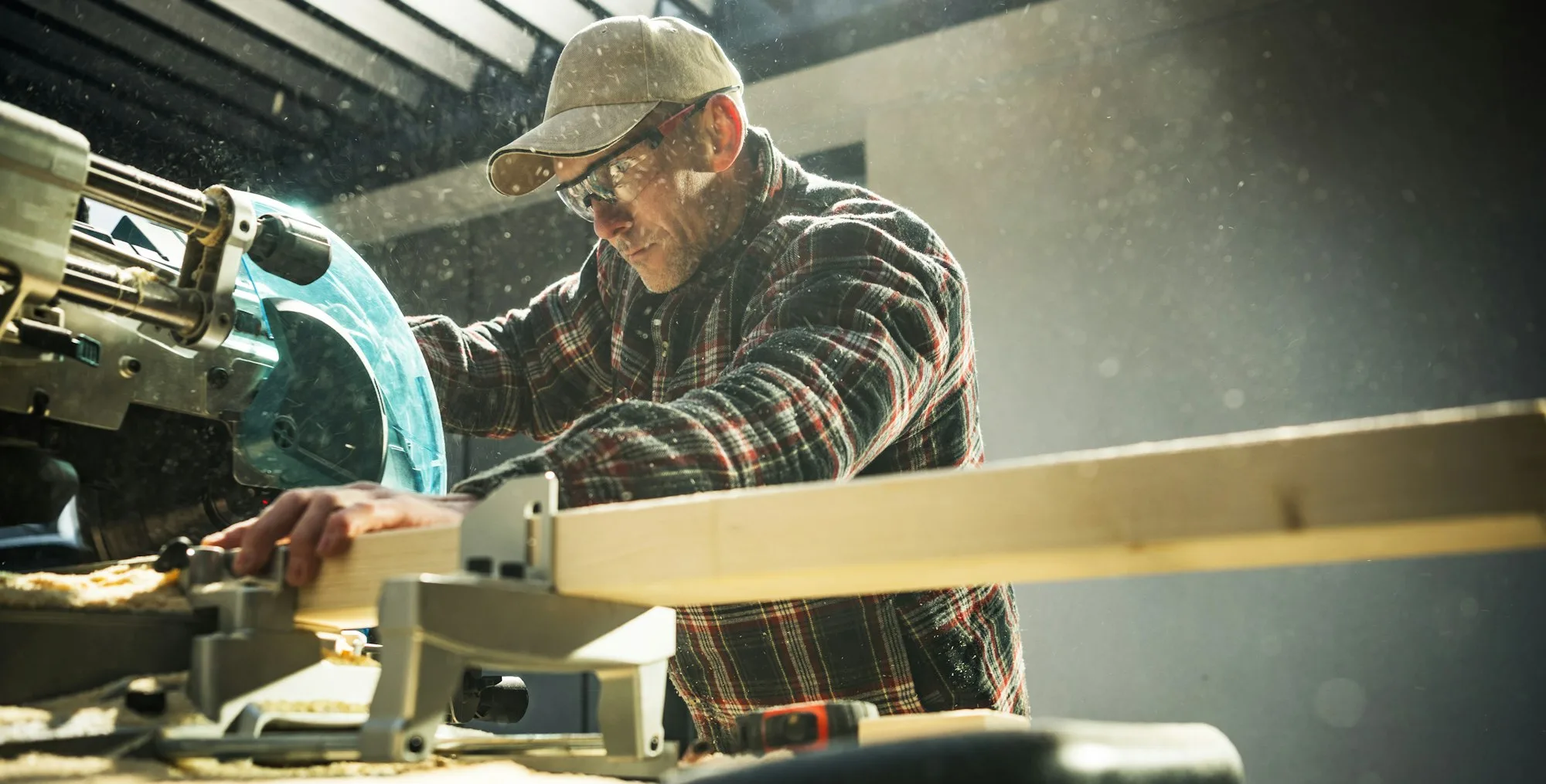 Woodworker General Construction Contractor Behind Powerful Wood Saw